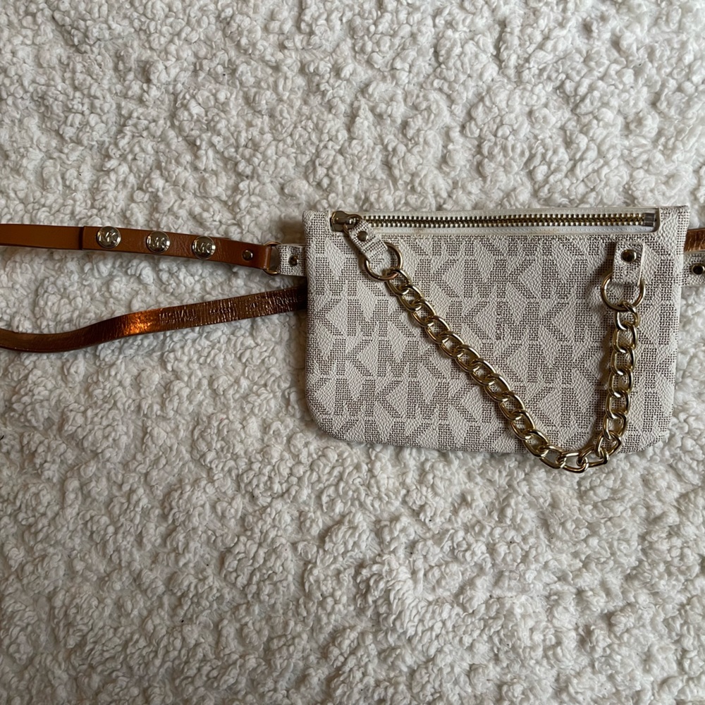 White and gold Michael Kors belt bag.